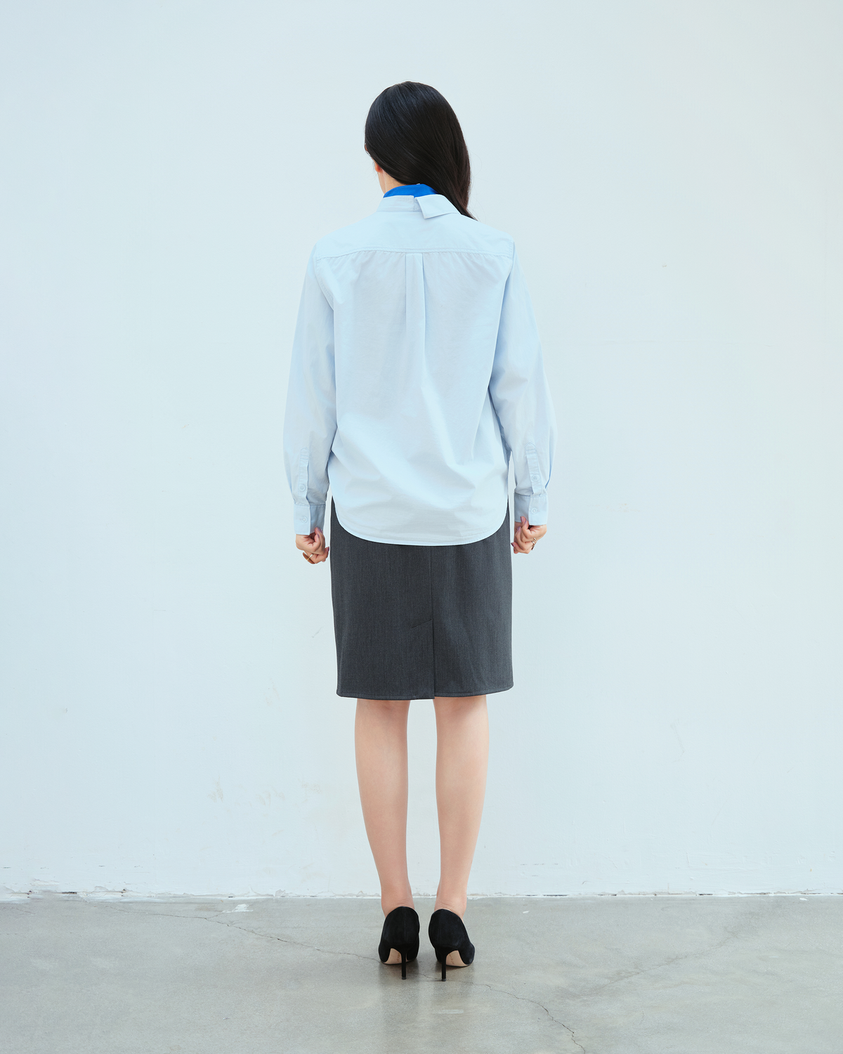 Woman in Building Skirt